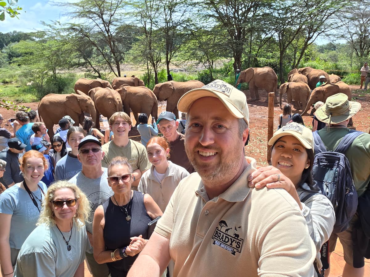 Brady with safari group and elephants
